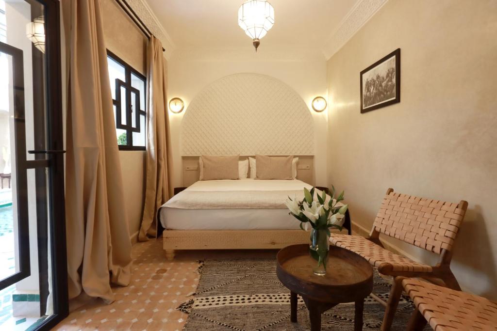 Postel nebo postele na pokoji v ubytování Riad Valentine