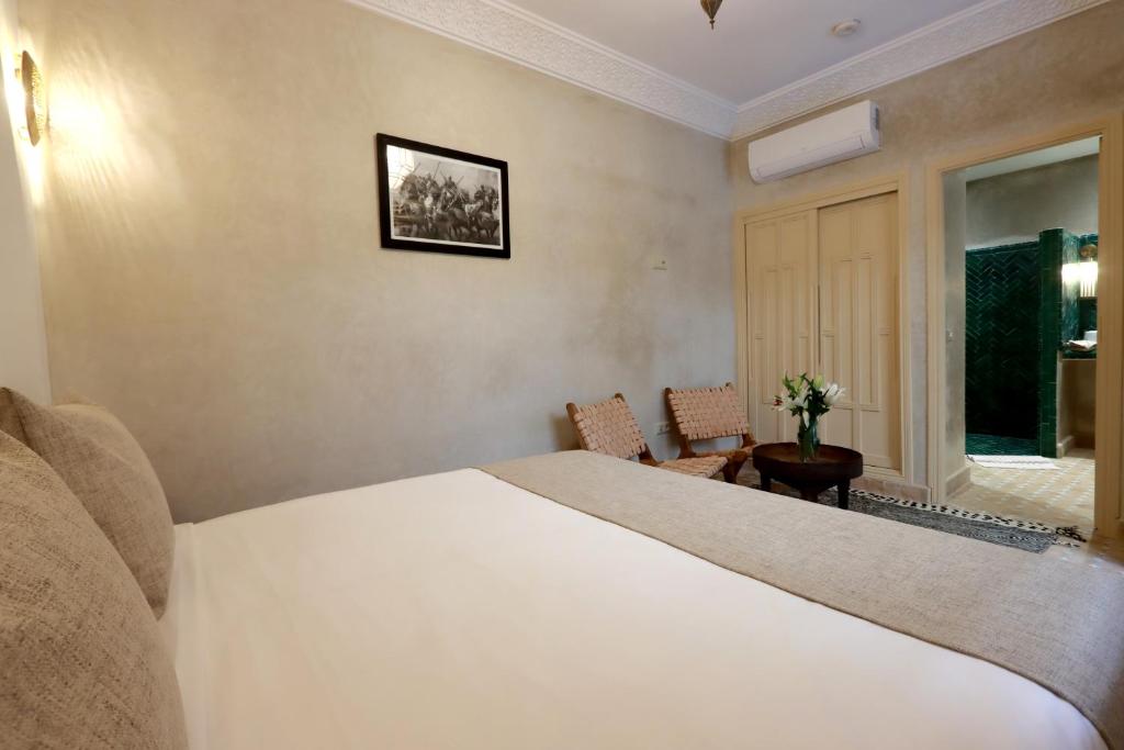 Postel nebo postele na pokoji v ubytování Riad Valentine