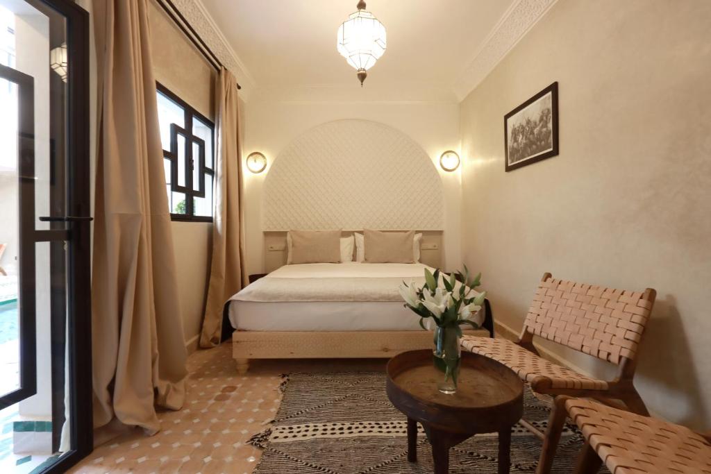 Postel nebo postele na pokoji v ubytování Riad Valentine