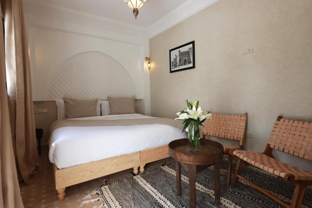 Postel nebo postele na pokoji v ubytování Riad Valentine
