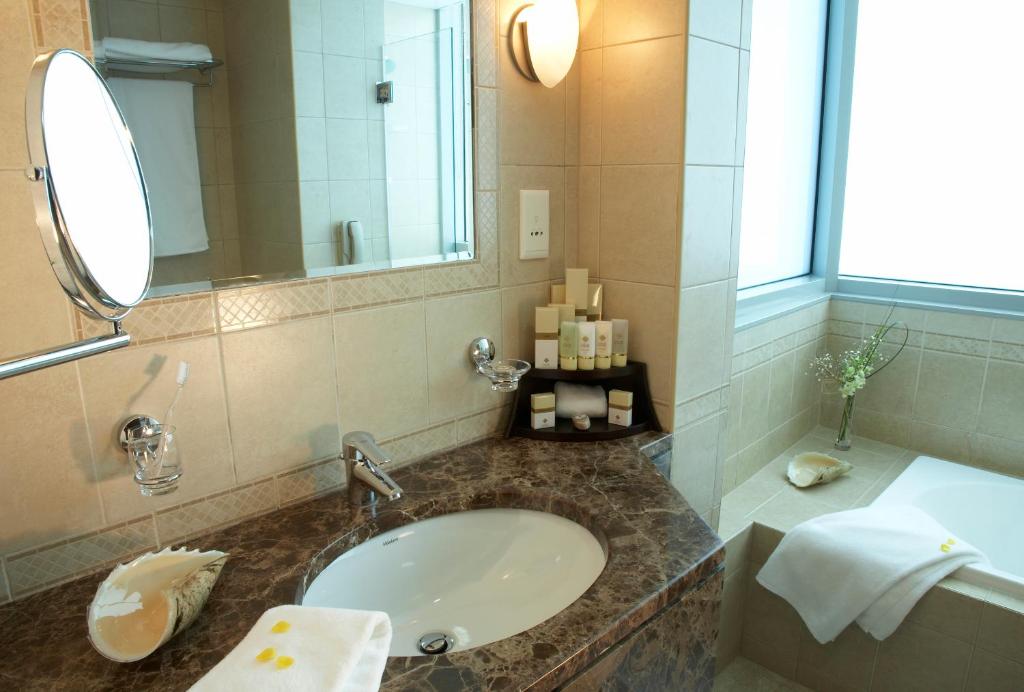 Koupelna v ubytování Al Manzel Hotel Apartments