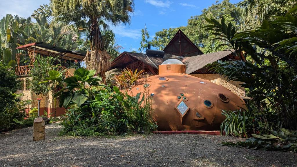 a large object in front of a house at Tree House Beachfront Lodge in Puerto Viejo
