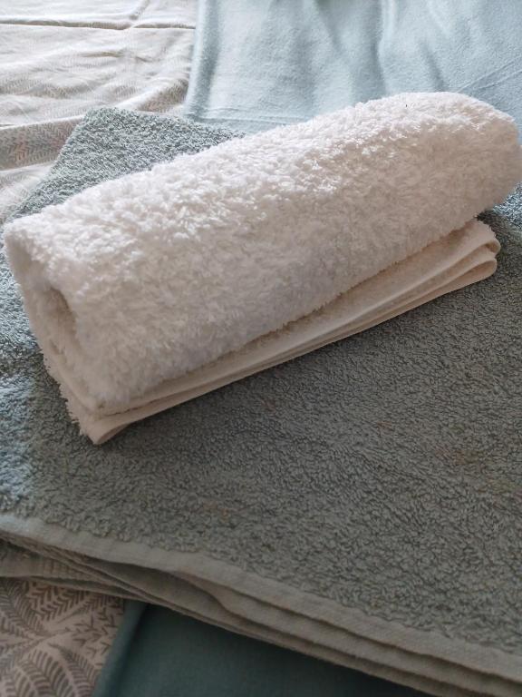 a white pillow sitting on top of a bed at Athina in Thessaloniki