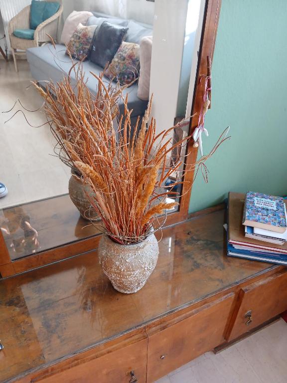a vase sitting on a table in a living room at Athina in Thessaloniki