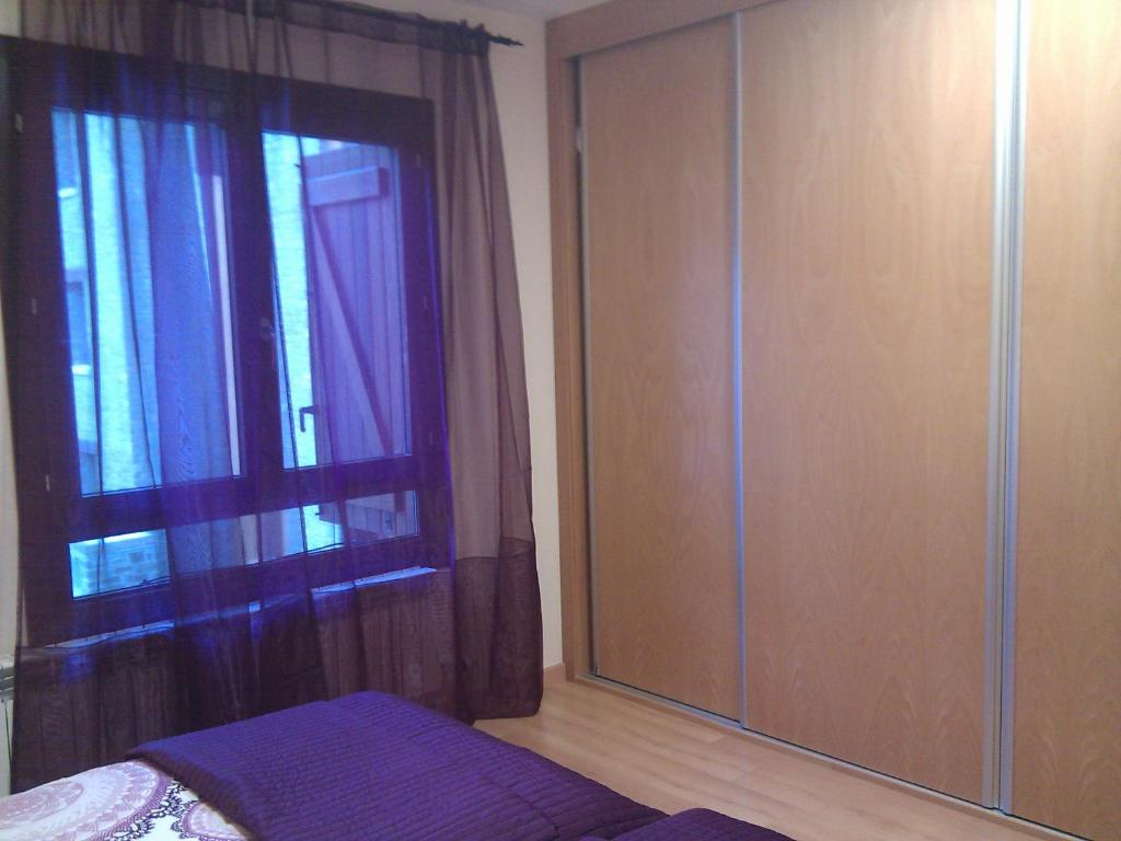 Postel nebo postele na pokoji v ubytování Apartamentos Argualas