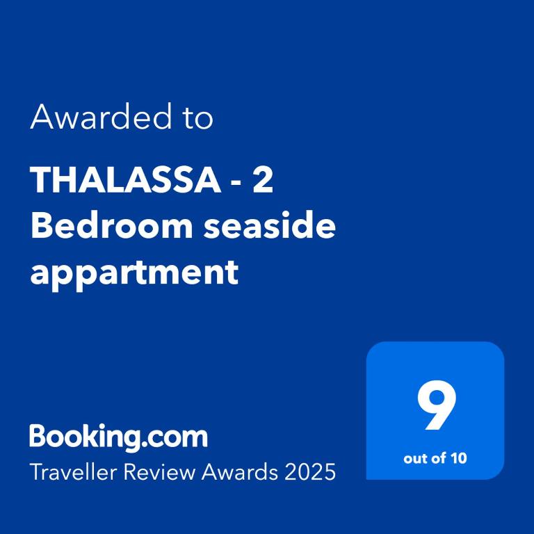 a screenshot of a phone with the text awarded to thiasasia bedroom accessible at THALASSA - 2 Bedroom seaside appartment in Polychrono