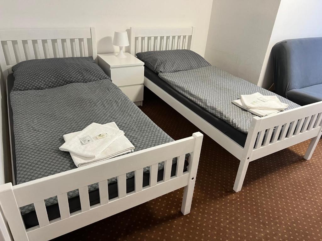 Postel nebo postele na pokoji v ubytování Pension Hájek