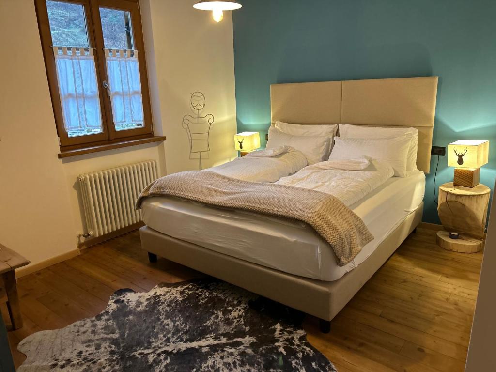 Postel nebo postele na pokoji v ubytování Agriturismo ValFraja