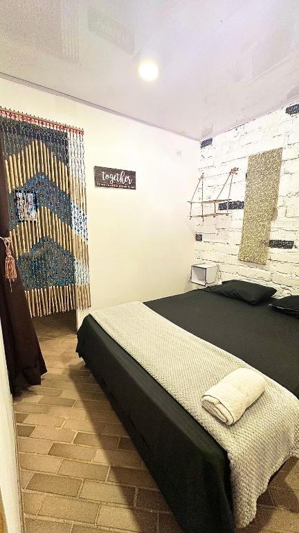 Postel nebo postele na pokoji v ubytování Casa Egos Pop Laureles