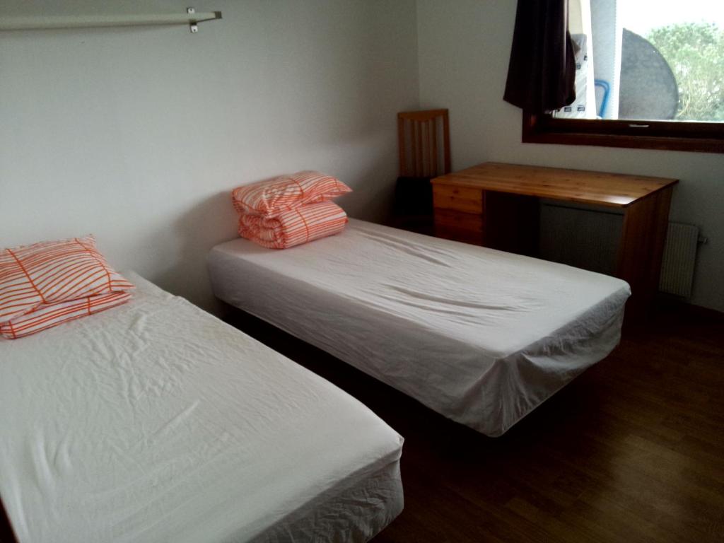 Postel nebo postele na pokoji v ubytování Gardenview Room