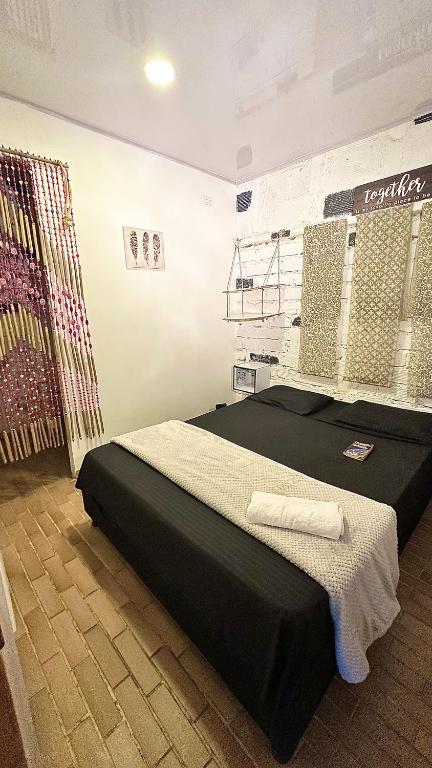 Postel nebo postele na pokoji v ubytování Casa Egos Pop Laureles
