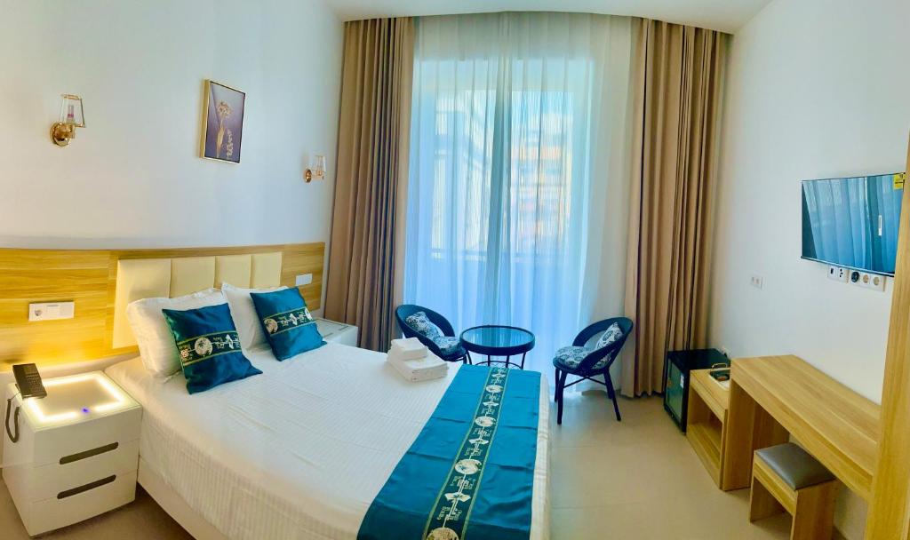 Postel nebo postele na pokoji v ubytování Lily holiday hotel
