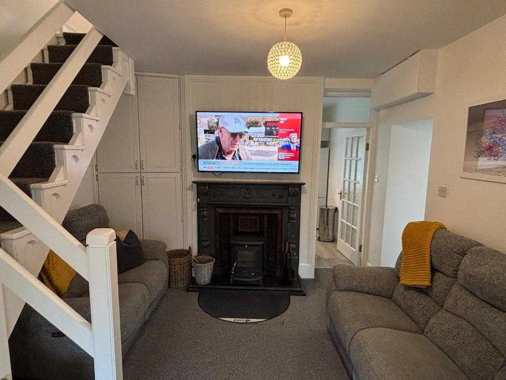 TV a/nebo společenská místnost v ubytování Cahir Cosy Cottage