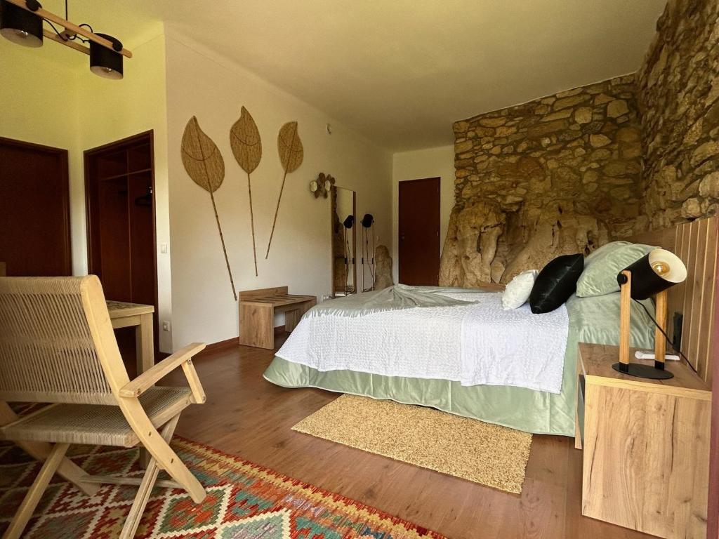 Ένα ή περισσότερα κρεβάτια σε δωμάτιο στο Pedra Oliveira