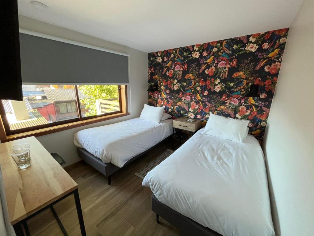 Postel nebo postele na pokoji v ubytování Mawün Hotel Pucón