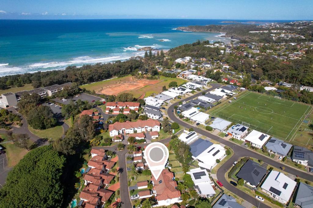 an aerial view of a suburb with the beach at Shearwater Luxury in Coffs Harbour