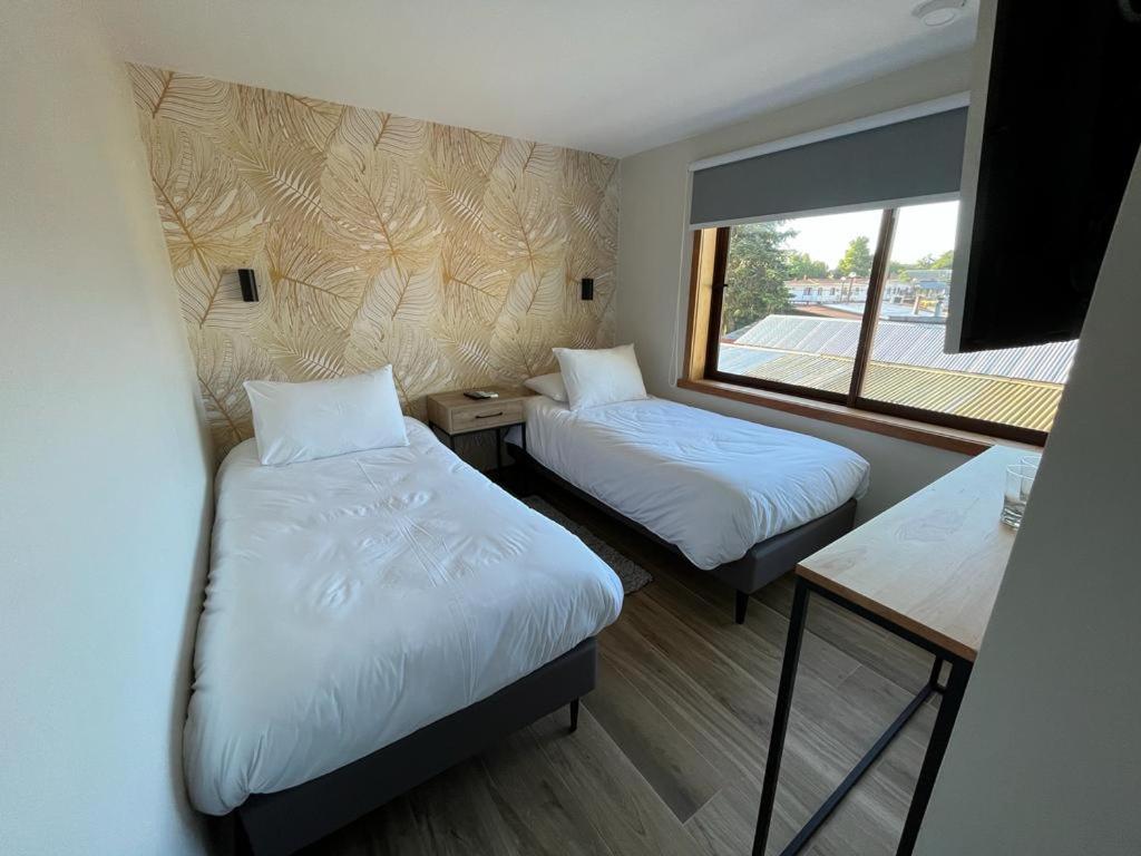 Postel nebo postele na pokoji v ubytování Mawün Hotel Pucón