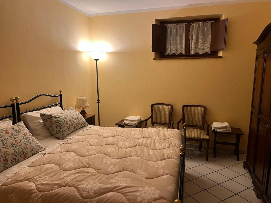 Ένα ή περισσότερα κρεβάτια σε δωμάτιο στο Casina Travi