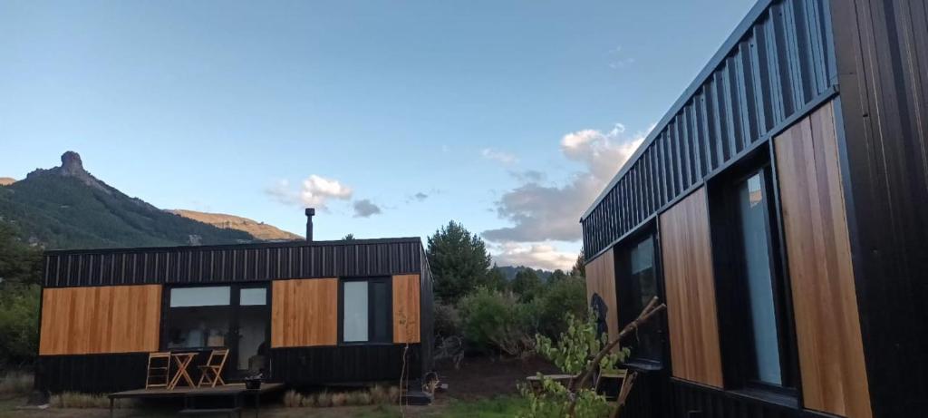 a house with a view of a mountain at Tinys Abedul in Lago Meliquina