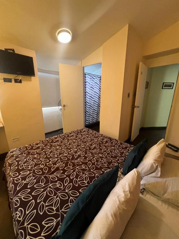 Postel nebo postele na pokoji v ubytování B&B Wasi Airport Lima