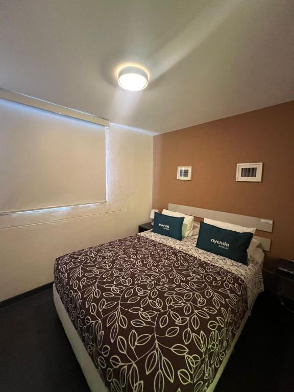 Postel nebo postele na pokoji v ubytování B&B Wasi Airport Lima