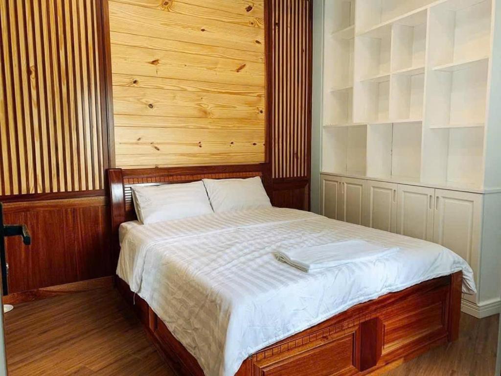Ein Bett oder Betten in einem Zimmer der Unterkunft NHỚ House IV