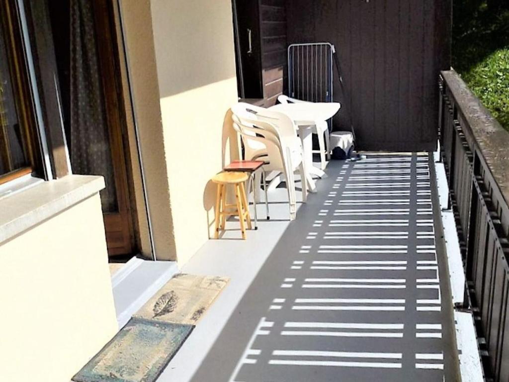 a balcony with a table and chairs on it at Studio in Veysonnaz by Ski Slopes & Gondola in Veysonnaz