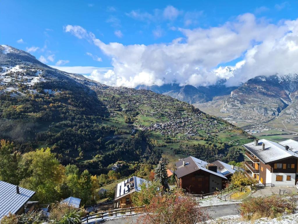 a view of a valley with mountains in the background at Flat in Veysonnaz near Ski Lift & Valley Views in Veysonnaz