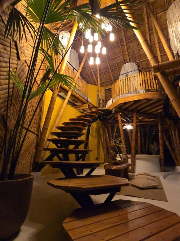 a room with a wooden stairs and a wooden bench at Balinesa Ecolodge in Valparaíso