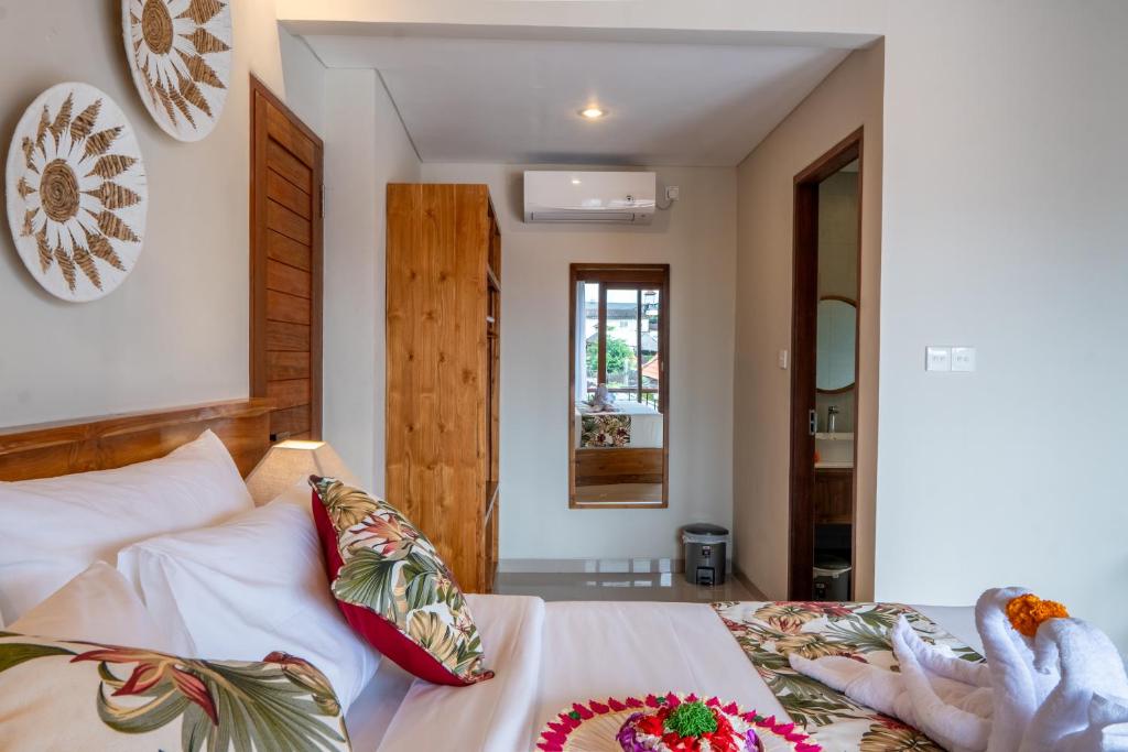 Postel nebo postele na pokoji v ubytování Meranggi Home Stay