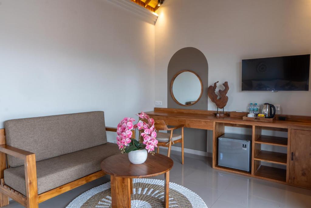 TV a/nebo společenská místnost v ubytování Meranggi Home Stay