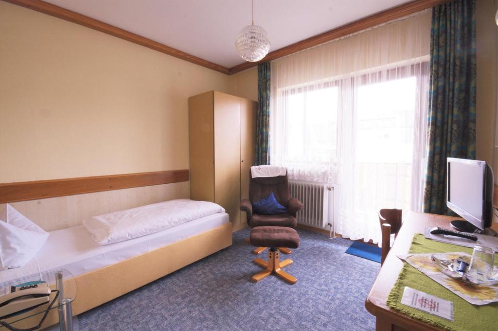 Postel nebo postele na pokoji v ubytování Hotel Weidenau