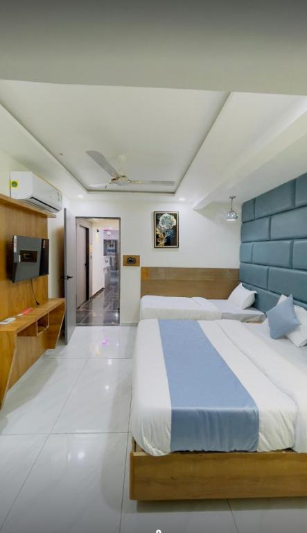 Postel nebo postele na pokoji v ubytování Hotel Skyland