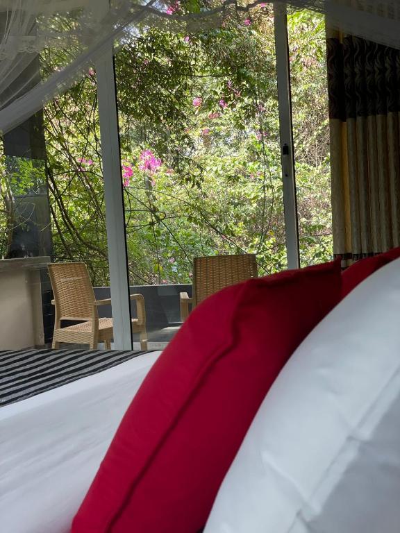 Postel nebo postele na pokoji v ubytování Villa Tambaka
