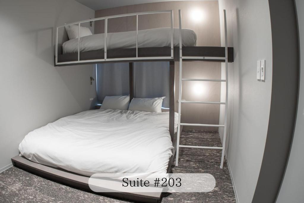 Postel nebo postele na pokoji v ubytování UNPLAN Residence suite