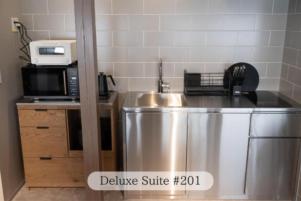 Kuchyň nebo kuchyňský kout v ubytování UNPLAN Residence suite