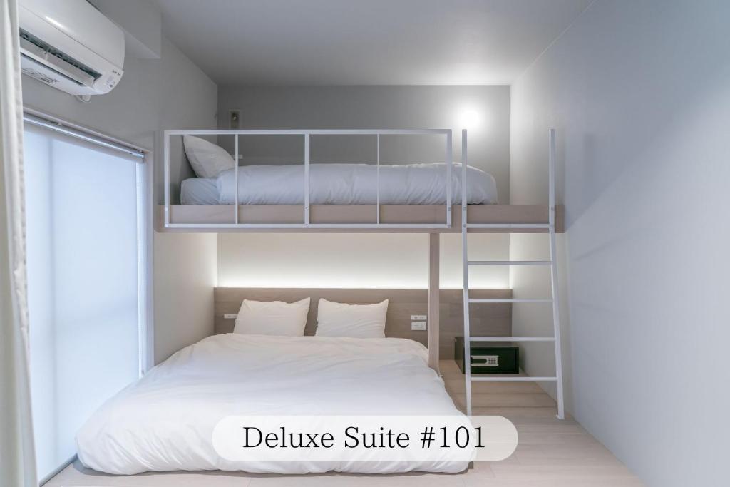 Postel nebo postele na pokoji v ubytování UNPLAN Residence suite