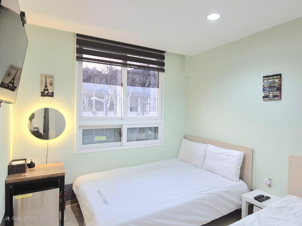 Cama ou camas em um quarto em Hostel Tommy Renewal 2025