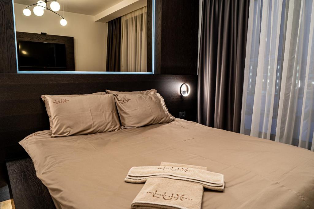 Postel nebo postele na pokoji v ubytování Brilijant Lux Apartman