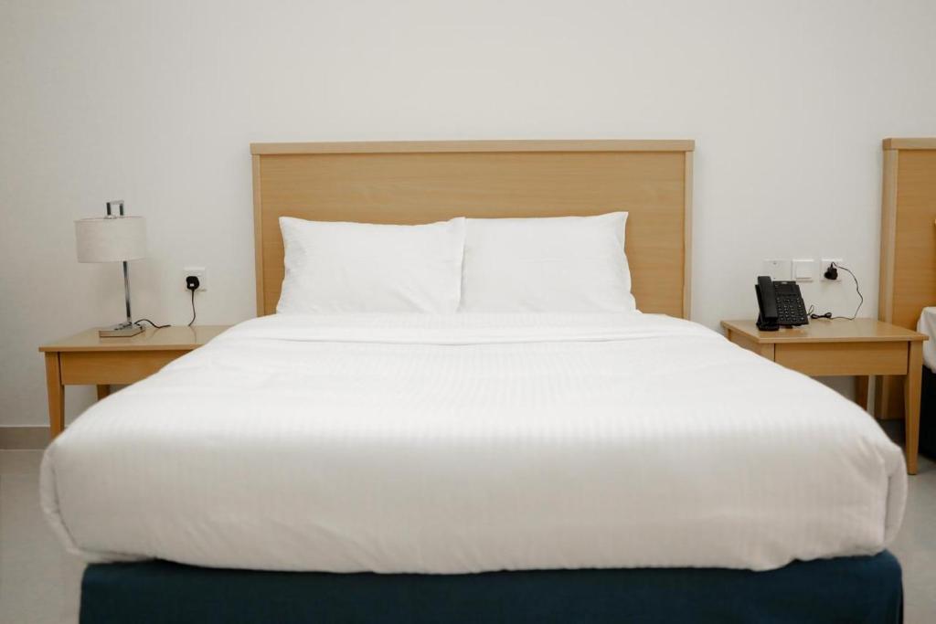 Postel nebo postele na pokoji v ubytování Assia Hotel