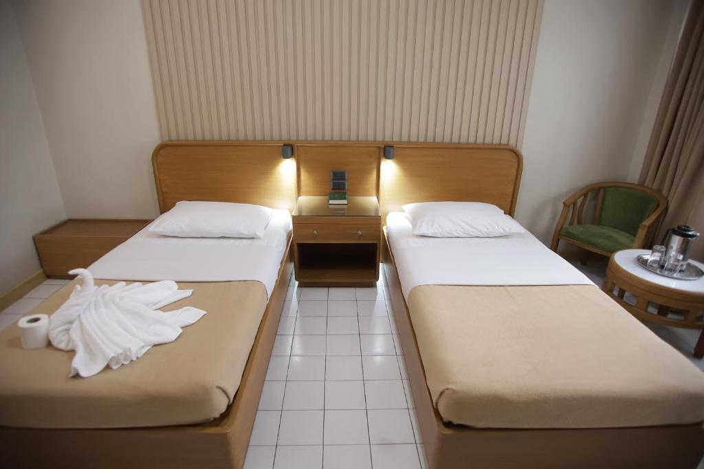 Postel nebo postele na pokoji v ubytování Hotel Soriente