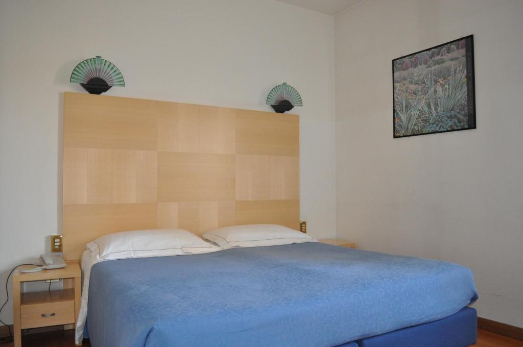 Postel nebo postele na pokoji v ubytování Hotel Igea