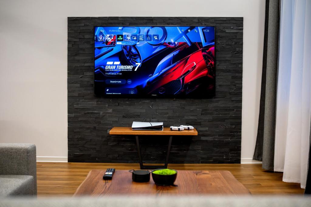 TV a/nebo společenská místnost v ubytování IT Centrum Apartments