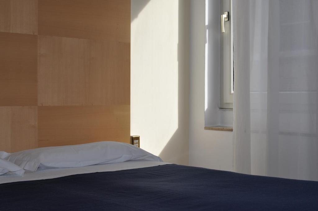 Postel nebo postele na pokoji v ubytování Hotel Igea