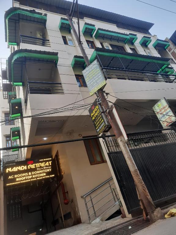 a building with signs on the side of it at NANDI RETREAT HomeStay in Varanasi
