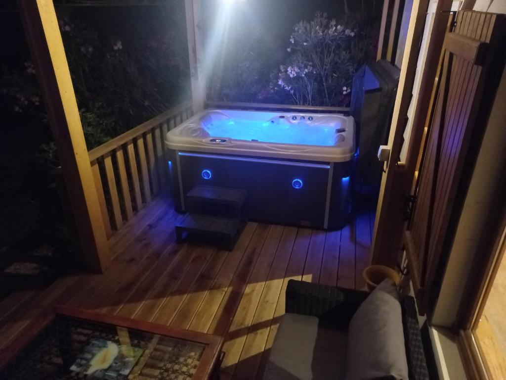 a jacuzzi tub on the porch of a house at La pampa in Cabannes