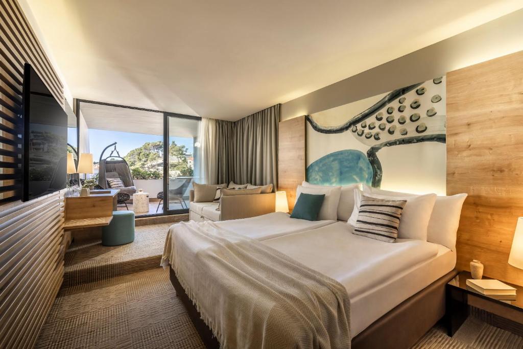 Postel nebo postele na pokoji v ubytování Valamar Padova Hotel