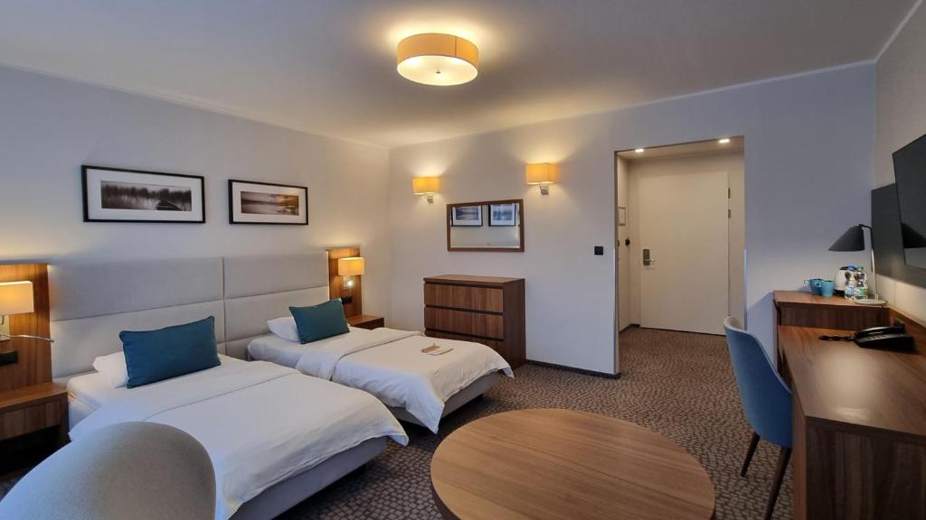 Posteľ alebo postele v izbe v ubytovaní Hotel Wolin