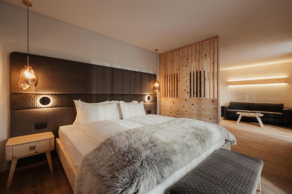 Postel nebo postele na pokoji v ubytování Hotel Tofana Cortina