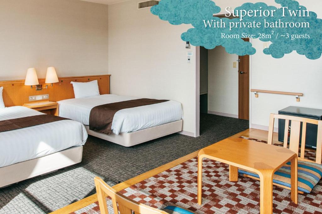 Postel nebo postele na pokoji v ubytování KAMENOI HOTEL Kii-Tanabe